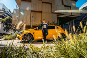 Male model in Paris with a yellow car